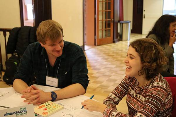 Two ambassadors sitting at a table