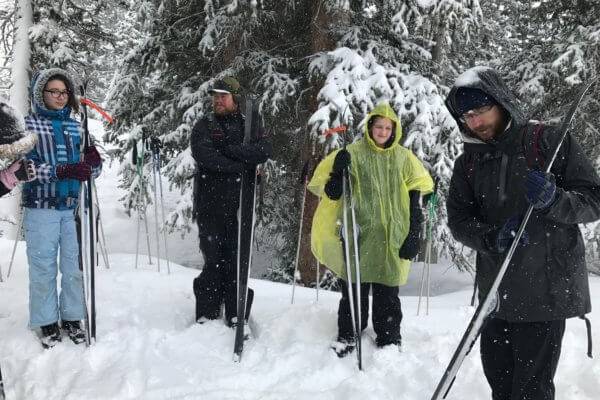 Ambassadors standing in the snow with ski gear