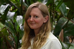 christina miller standing in front of greenery