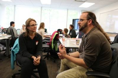 Ambassadors Tara Deans and Kevin Davenport discuss ideas at the science communication workshop.