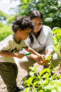 Mariel with a student looking at plants