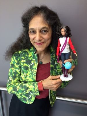 STEMAP DIrector Nalini Nadkarni posing with her one-of-a-kind doll