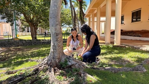 Serena and student outside near a tree