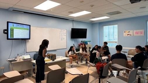 Serena in a classroom with students