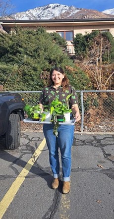 Patricia Girardi with a tray of plants
